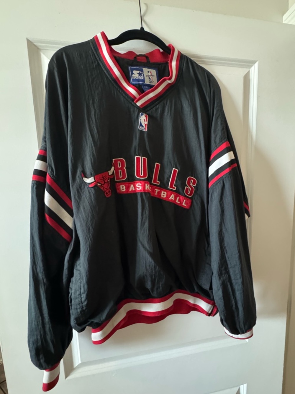 STARTER Black Pullover with Red & White Striped Collar